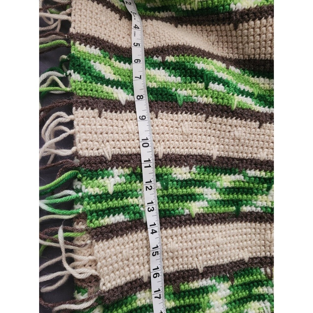 Vintage handmade knitted or crocheted throw blanket with a striped patter  45x80